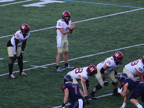 Harvard quarterback Charlie Dean surveying the Penn defense, on his way to one of the best days in Harvard quarterback history.